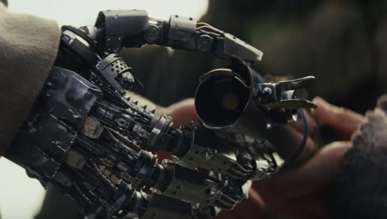 Immagine del trailer di The Last Jedi che mostra Luke prendere in mano la spada da Rey.