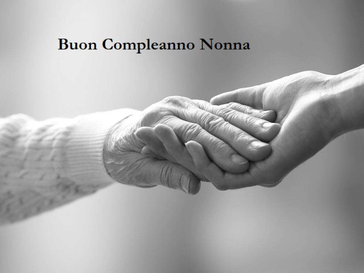 100 modi per dire buon compleanno Nonna! - Old and young holding hands on light background, closeup