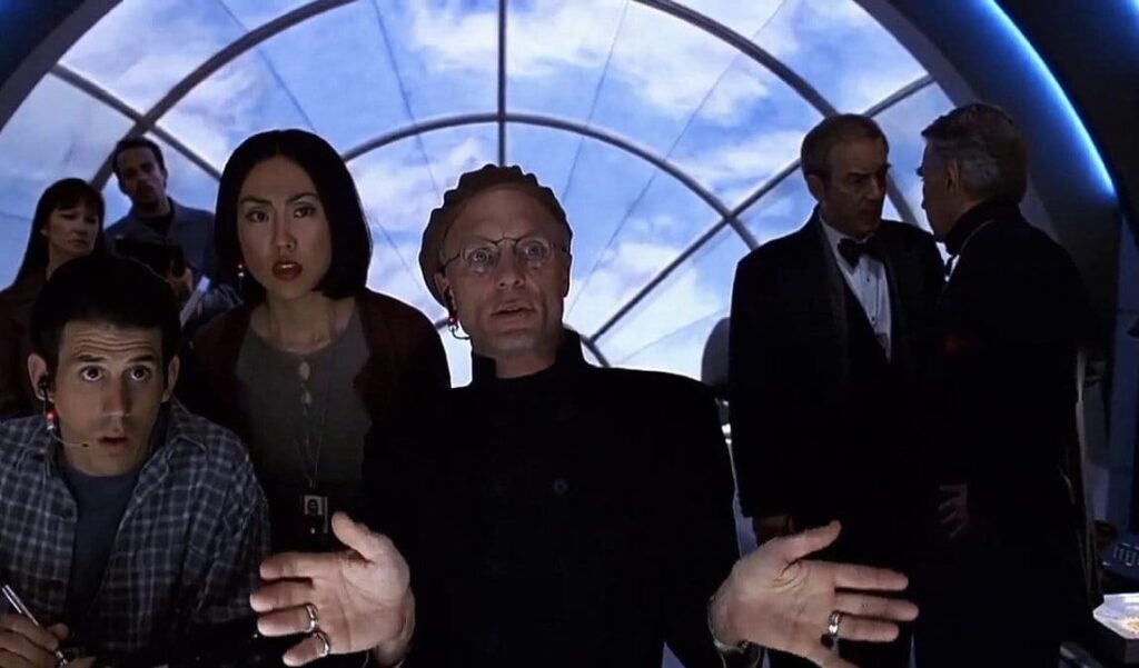 Christof e la troupe, dietro gli schermi mentre osservano i comportamenti sempre più strani di TrumanCredits: Paramount Pictures