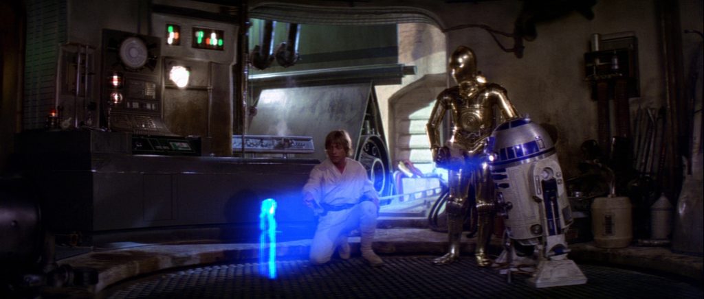 R2D2 trasmette il messaggio di Leia a Obi Wan in Episodio IV.Fonte: Cineparade.eklablog