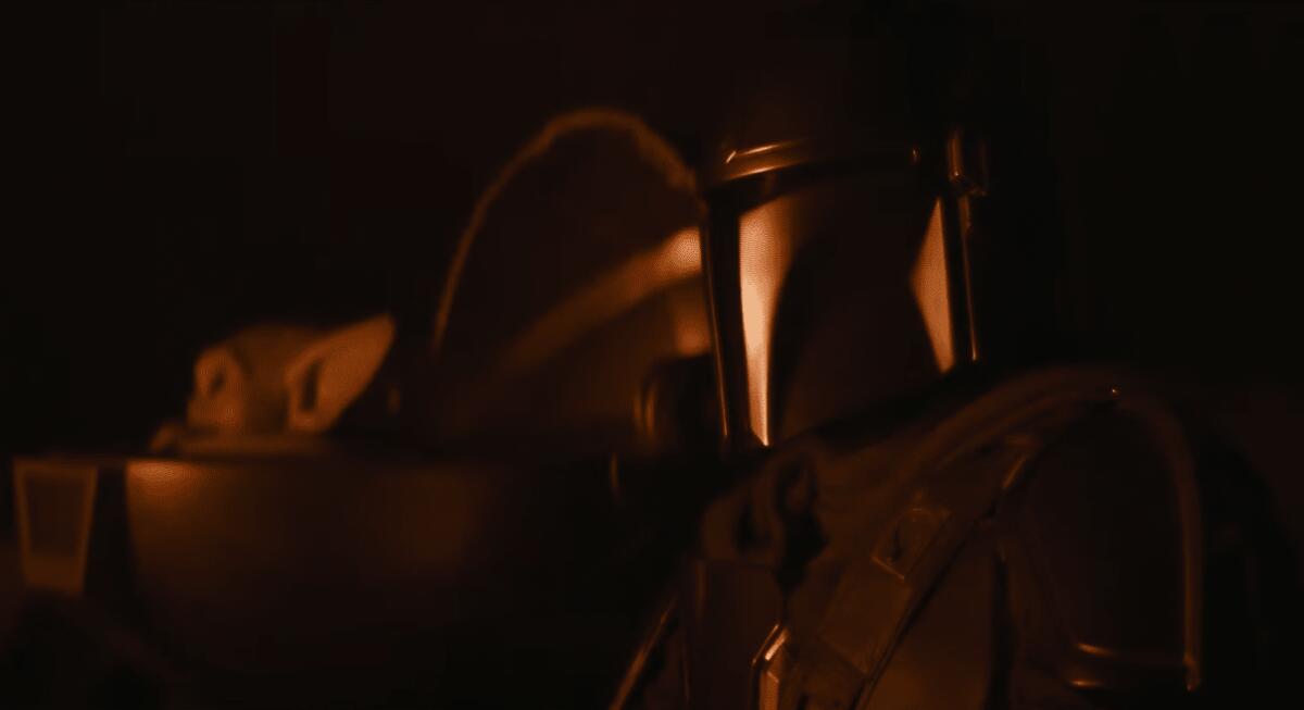 Star Wars by the Fire: ecco il nuovo video rilassante con Mando e Grogu! - Din Djarin e Grogu intorno al fuoco