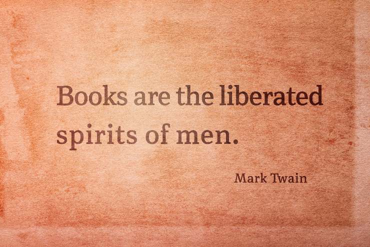 Books are the liberated spirits of men - famous American writer Mark Twain quote printed on vintage grunge paper